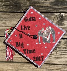 a red graduation cap with the words gota live it's big time on it