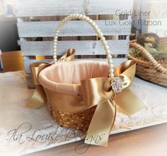 a basket that is sitting on top of a table with pearls and ribbon around it