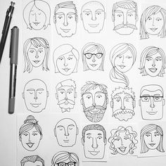 a bunch of faces drawn on paper next to a pen