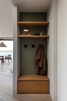 a coat rack in the corner of a room