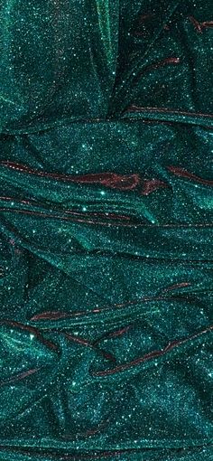 green glitter fabric with red lines on it