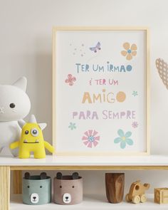 a white shelf topped with toys next to a stuffed animal on top of a wooden table