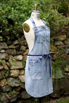 a mannequin wearing an apron made out of denim