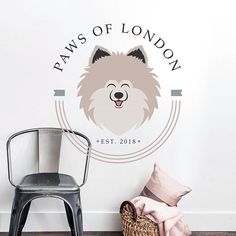 there is a wall decal with a dog on it and the words paws of london