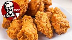 fried chicken on a white plate with kfc logo