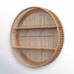 a round wooden shelf with two shelves on the top and bottom, made out of wicker