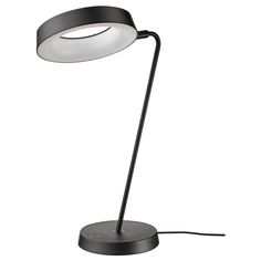 a black table lamp with a white light on the top and an oval shaped base