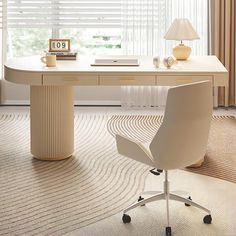 a white desk and chair in front of a window with blinds on the windowsill