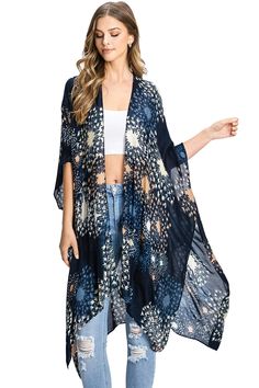 Beautiful kimono cardigan with an open-front and 3/4 length sleeves. Soft woven fabric with an abstract pattern. Perfect for light layering over casual outfits! CARE | Hand Wash Cold CONTENTS | 100% Viscose MEASUREMENTS | 40"/102 cm Top to Bottom (Size O/S) MODEL | 5'8 - wearing O/S IMPORTED Casual Fall Cover-up With Kimono Sleeves, Summer Kimono With Abstract Print, Floral Print Open Front Outerwear For Beach, Fall Rayon Kimono With Kimono Sleeves, Summer Kimono With Abstract Print And Kimono Sleeves, Summer Kimono For Layering, Summer Long Sleeve Kimono For Layering, Long Sleeve Summer Kimono For Layering, Summer Layering Long Sleeve Kimono