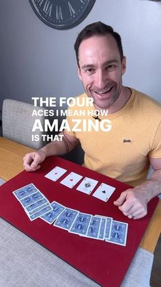 a man sitting at a table with cards in front of him and the words, the four ages mean how amazing is that