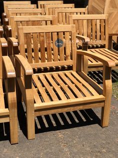 several wooden chairs sitting next to each other