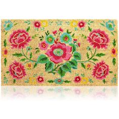 a door mat with pink flowers and green leaves on the front, along with a white background