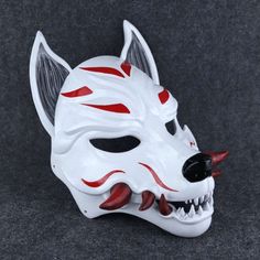 Experience the mystique of traditional Japanese folklore with SpaceArmory's Kitsune Japanese Fox Mask. Detailed and hand-crafted to precision, our mask captures the beauty and elegance inherent of the mythical fox spirit in Japanese culture. Details: We cushioned the inside of the mask with soft eva foam to keep your face comfortable. The mask can stay on your face for a long time in the activity you use. It does not cause pain on your face and you can breathe comfortably. It is very robust in y White Adjustable Masks And Prosthetics For Masquerade, Adjustable White Mask, Adjustable White Masks And Prosthetics For Masquerade, Adjustable White Masks And Prosthetics, Kitsune Spirit, Japanese Fox Mask, Traditional Mask, Japanese Fox, Kitsune Mask