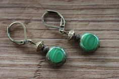 Emerald Green Earrings Czech Glass Earrings Dangle Drop Earrings SMALL EARRINGS Gift for women Color : Emerald green czech glass beads 11mm Finish : Antiqued brass findings Size : Approx 1-3/4 inches including the antique brass lever back Ear wires : Antique Brass lever back Czech Glass Earrings : https://www.etsy.com/shop/NtikArtJewelry?ref=hdr_shop_menu§ion_id=16062218 Thanks for looking Green Adjustable Vintage Earrings, Green Vintage Earrings, Czech Glass Jewelry, Small Dangle Earrings, Emerald Green Earrings, Rustic Earrings, Teardrop Dangle Earrings, Fall Earrings, Red Earrings