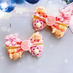 This price is for a pair of hairclips only, others are not included. Fun Pink Hair Accessories For Spring, Playful Bow Headband Hair Accessory, Pink Hair Bow Accessories For Spring, Spring Pink Hair Accessories With Bow, Playful Bow Hair Accessories For Summer, Playful Bow Hair Accessories For Gift, Cute Butterfly Knot Bow For Spring, Cute Bow With Butterfly Knot For Gifts, Cute Butterfly Knot Bow For Gift