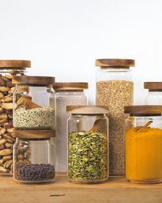 several jars filled with different types of spices