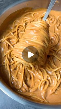 a bowl filled with noodles and peanut butter