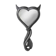 a heart shaped mirror with horns hanging from it's sides, on a white background