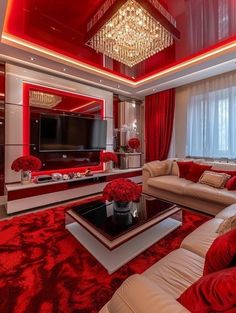 the living room is decorated in red and white with chandelier hanging from the ceiling