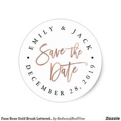 save the date sticker with gold foil lettering on white paper, and black ink