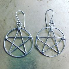 Rustic Pentacle Earrings Wiccan JewelryPentacles with rustic styling, ancient symbolism. Handmade pentacle earrings, joined with molten metal, polished for protection. Circle width is about 1 1/4". Measurement from curve of earwire is about a 2 1/8".Handmade surgical steel earwires. Wiccan Jewelry Hippie, Handmade Metal Witchy Earrings, Protection Circle, Pentacle Ring, Witchy Black Nickel-free Earrings, Pentacle Earrings, Molten Metal, Orange Dots, Pentacles