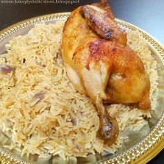 a plate with rice and chicken on it