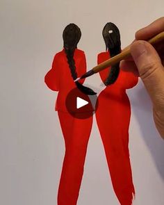 someone is drawing two women in red outfits