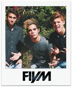 three young men posing for a photo in front of some bushes with their mouths open