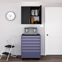 a room with a chair, cabinet and clock on the wall next to a step ladder