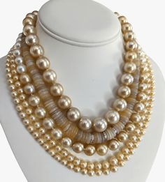 Indulge in the elegance and natural beauty of this stunning South Sea pearls necklace, featuring Golden South Sea pearls sourced from Indonesia. Crafted with meticulous attention to detail, this necklace is a testament to exceptional craftsmanship and exquisite materials. Secured with a 14K yellow gold 'twist and lock' clasp, the necklace measures 17.25 inches (43.5cm) in length, draping gracefully around the neckline. The weight of 95.7g adds a substantial feel and underscores the luxurious qua Gaudy Jewelry, Fine Pearl Jewelry, South Sea Pearl Necklace, Diamond Bracelet Design, Pearl Beach, Golden South Sea Pearls, Pearl Necklace Designs, Jewelry Styles, Black Beaded Jewelry