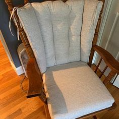 a rocking chair with a pillow on top of it