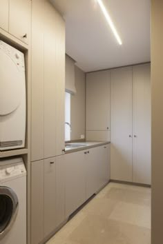 a washer and dryer in a very large room