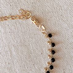 18k Gold Filled Black Beaded Bracelet Metal: 18k Gold Filled Measures 7.25 inches in total length. Weights 4.1 grams Hypoallergenic jewelry - Nickel Free Water resistant Rigorously manufactured under CA Prop 65 and EU standards Made in Brazil Black Dangle Jewelry With Faceted Beads, Black Faceted Beads Dangle Jewelry, Gold Bracelet With Black Beads Jewelry, Gold Bracelet Jewelry With Black Beads, Gift Black Beaded Chain Bracelet, Black Beaded Chain Bracelet For Gift, Black Beaded Bracelet As Gift, Black Beaded Dainty Jewelry, Dainty Black Beaded Jewelry