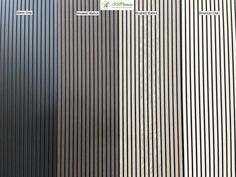 two tall buildings with vertical lines on the front and back sides, one in black and one in white