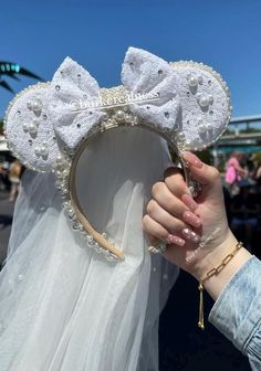 Handmade Mickey Ears created by me!! Each gem is hand-placed. Battery operated lights.  Process time: 1-2 weeks, depending on how many orders  No returns  If you would like custom Ears please message me. Crocheted Mickey Ears, Bride Mickey Ears, Wedding Mickey Ears, Bridal Mickey Ears, Bedazzled Mickey Ears, Rhinestone Mickey Ears, Cinderella Mickey Ears, Minnie Mouse Ears Headband, Battery Operated Lights