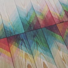 the wood is painted with multicolored paint