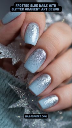 This close-up captures a chic and elegant manicure featuring a soft baby blue base adorned with a dazzling glitter gradient. The shimmering silver glitter cascades from the tips, blending seamlessly into the delicate pastel hue, creating a frosty, winter-inspired look. The glossy finish adds an extra touch of sophistication, while the subtle sparkle offers just the right amount of glamour. Perfect for both everyday wear and special occasions, these nails exude calm elegance with a hint of festive charm. Light Blue With Sparkle Nails, Cute Simple Nails For January, Blue Glitter Gradient Nails, Cute Short New Years Nails, December Nails Blue And Silver, Silver Holiday Nails Christmas, Winter Nails Blue And Silver, January Theme Nails, Easy January Nails