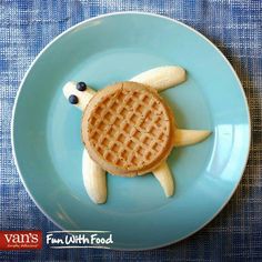 a waffle shaped like a turtle on a blue plate