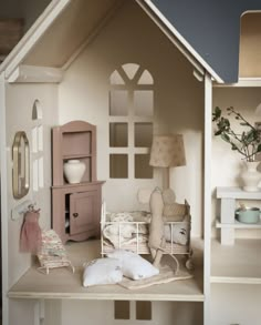 a doll house is shown with furniture and accessories