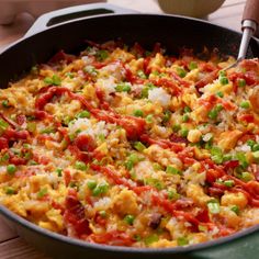 a pan filled with food on top of a wooden table