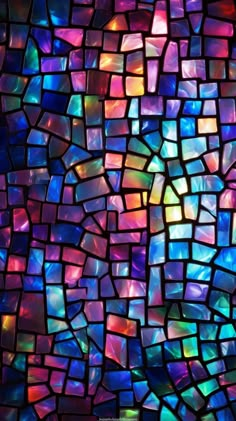 an abstract mosaic pattern made up of multicolored glass tiles, all in different sizes and colors