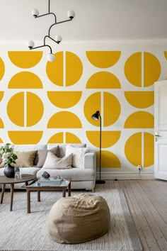 a living room with yellow and white wallpaper