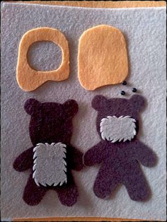 two felt teddy bears with speech bubbles on the top one is purple and white, while the other is brown