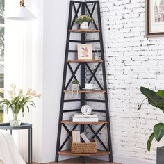 a leaning shelf with books on it in a living room next to a brick wall