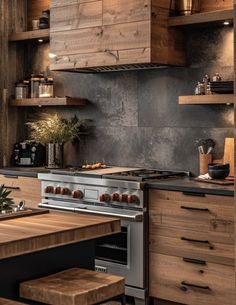 a kitchen with an oven, counter top and wooden shelves on the wall above it