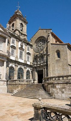 an old church with stone steps leading up to it