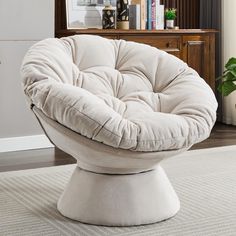 a white chair sitting on top of a rug