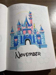 an open book with a drawing of a castle and the words november written on it