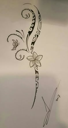 a drawing of a flower on the side of a white wall with black ink writing