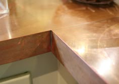 a kitchen counter top with a plate on it and a bowl in the background,